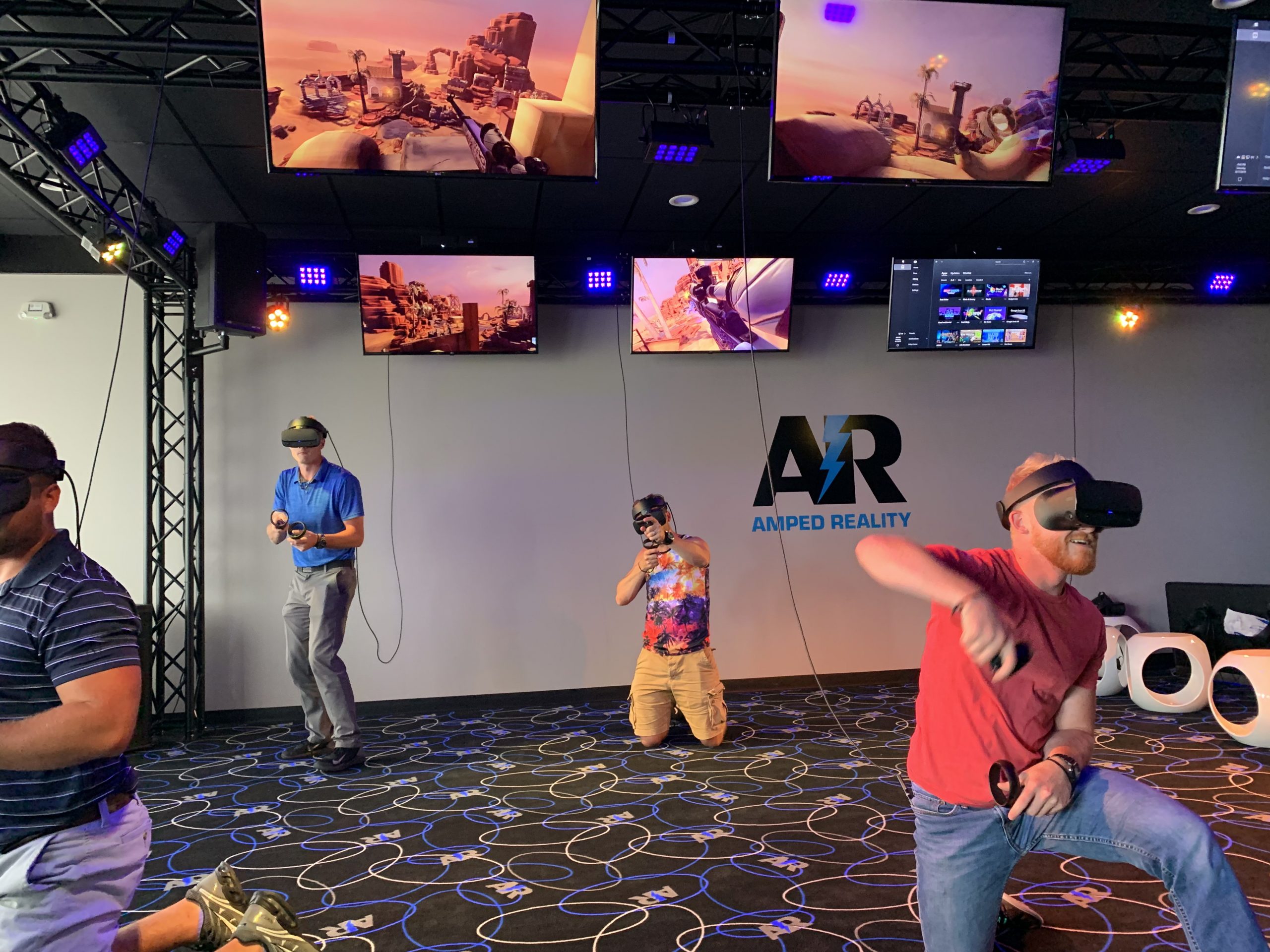Men playing virtual reality games at Amped Reality in Grand Rapids Michigan.